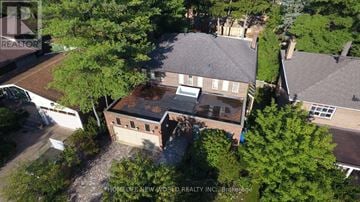Markham (Thornhill) apartment for rent - A bird's eye view of a house surrounded by trees.