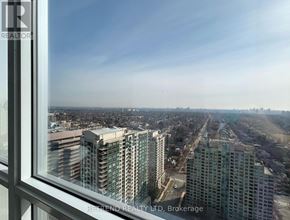 Toronto (Willowdale West) condo for rent - A view from a high-rise building looking out over a cityscape.