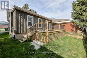 Woodstock (Woodstock - South) apartment for rent - A house with a deck and a small tree in front.