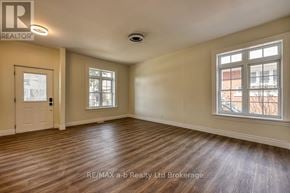 Woodstock (Woodstock - South) apartment for rent - A room with wooden flooring and two windows.