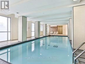 Toronto (Bendale) condo for rent - A swimming pool inside a building with a glass bottom.