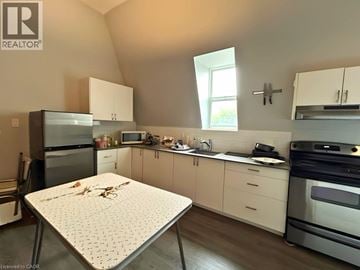 Hamilton apartment for rent - A kitchen with a table and a fridge.