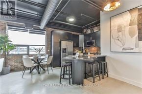 London North (North E) condo for rent - A modern kitchen with a dining table and chairs.
