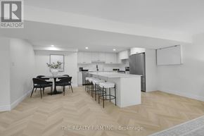 London North (North O) apartment for rent - A well-lit kitchen with a dining table and chairs.