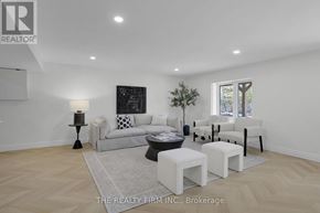 London North (North O) apartment for rent - A well-lit, spacious living room with a white sofa and a black and white artwork on the wall.
