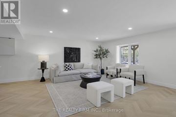 London North (North O) apartment for rent - A well-lit, spacious living room with a white sofa and a black and white artwork on the wall.