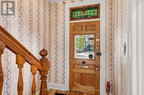 Ottawa apartment for rent - A wooden door with a glass window above it.