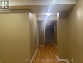 Brampton (Fletcher's Meadow) apartment for rent - A hallway with a light on the ceiling and a door at the end.