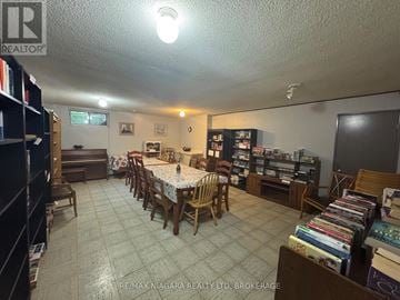 Midland multi-family for rent - A living room with a dining table and chairs.