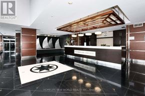 Toronto (Waterfront Communities) condo for rent - A lobby with a black and white rug and a wooden ceiling.
