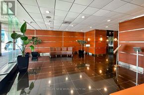 Toronto (Waterfront Communities) condo for rent - A reception area with a glass table and chairs.