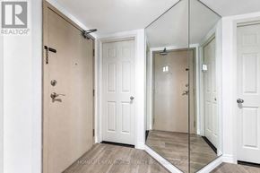 Toronto (Waterfront Communities) condo for rent - A white door with a mirror on the wall.