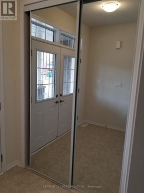 Thorold (Hurricane/Merrittville) apartment for rent - A white door with a mirror on the right side.