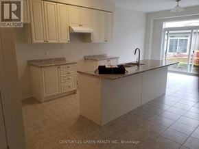 Thorold (Hurricane/Merrittville) apartment for rent - A kitchen with a sink, cabinets, and a window.