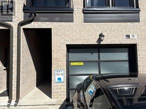 Markham (Cornell) townhouse for rent - A car is parked in front of a building with a sign that reads "BULK 5 TH-12".
