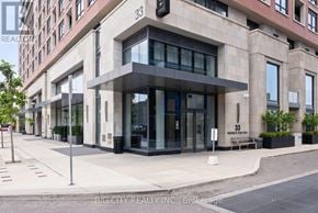 Toronto (Thorncliffe Park) condo for rent - A modern building with the number 33 on it.