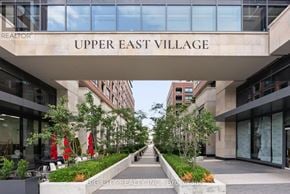 Toronto (Thorncliffe Park) condo for rent - A view of a street with a building that says Upper East Village.
