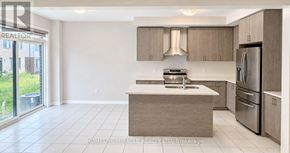 Cambridge apartment for rent - A modern kitchen with a large island and stainless steel appliances.