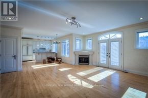 Toronto (Newtonbrook East) apartment for rent - A spacious living room with wooden floors and a fireplace.