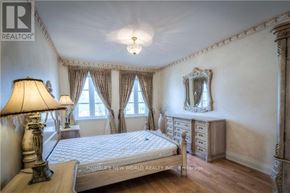 Toronto (Newtonbrook East) apartment for rent - A bedroom with a bed, dresser, and mirror.