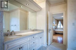 Toronto (Newtonbrook East) apartment for rent - A bathroom with a double sink vanity and a large mirror.