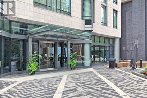 Toronto (Church-Yonge Corridor) condo for rent - A building with a glass entrance and a sign that says "REALTOR".