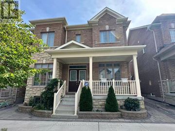 Markham (Cornell) apartment for rent - A house with a front porch and a tree in front of it.