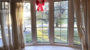 Toronto (Don Valley Village) apartment for rent - A room with a large window and a red bow on the window.