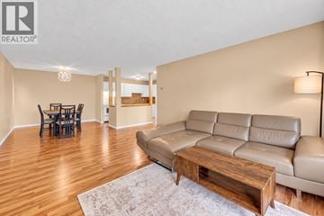 Maple Ridge apartment for rent - A living room with a leather couch and a wooden coffee table.
