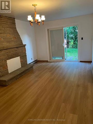 Toronto (Don Valley Village) apartment for rent - A room with wooden floors and a chandelier.