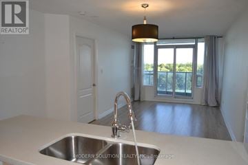 Toronto (Bayview Village) condo for rent - A modern kitchen with a sink and a window.