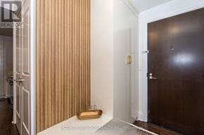 Toronto (Willowdale East) condo for rent - A room with a wooden door and a white door.