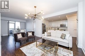Toronto (Willowdale East) condo for rent - A modern living room with a white couch and a coffee table.