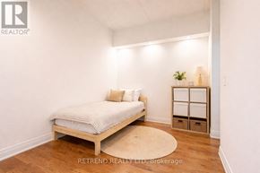 Toronto (Downsview-Roding-Cfb) condo for rent - A bedroom with a bed, nightstands, and a rug.