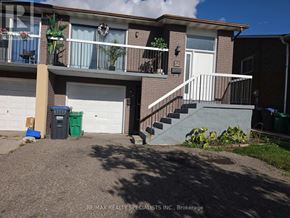 Brampton (Madoc) apartment for rent - A two-story apartment building with a white door and windows.