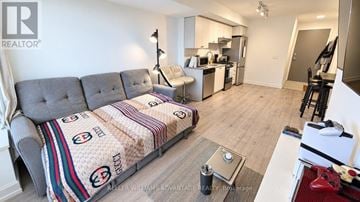 Toronto (Weston) condo for rent - A living room with a grey sofa and a coffee table.