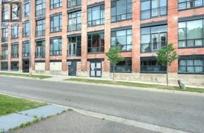 Kitchener condo for rent - A red brick building with the word REALTOR on the side.