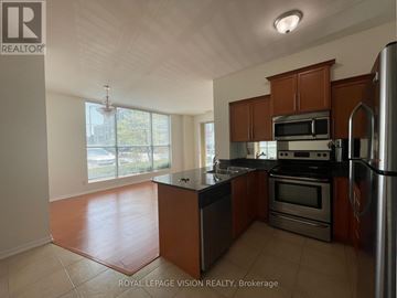 Toronto (Malvern) condo for rent - A kitchen with brown cabinets and stainless steel appliances.