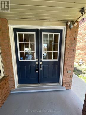 Brampton (Fletcher's Meadow) apartment for rent - A black double door with a glass window and a handle.