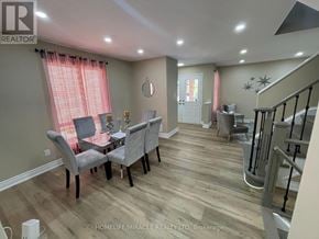 Brampton (Fletcher's Meadow) apartment for rent - A living room with a grey sofa and a wooden floor.
