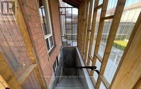 Brampton (Fletcher's Meadow) apartment for rent - A view from the top of a staircase looking down into a house under construction.