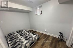 Brampton (Fletcher's Meadow) apartment for rent - A bedroom with a bed and a tripod in it.