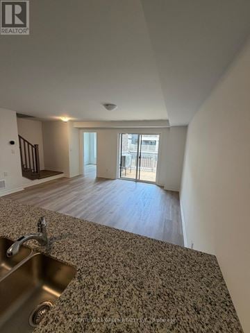 Kitchener townhouse for rent - A kitchen with a sink and a window.