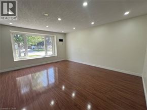 Cambridge apartment for rent - A room with wooden flooring and a window showing an outdoor view.
