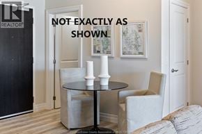 Lasalle condo for rent - A black and white photo of a room with a table and chairs.