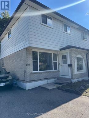 Oshawa (Vanier) apartment for rent - A house with the number 357 on it.