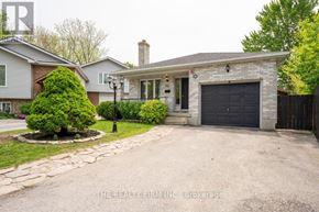 London East (East L) apartment for rent - A house with a garage and a driveway in front.
