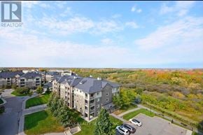 Brampton (Goreway Drive Corridor) condo for rent - A large apartment complex with a parking lot in front.
