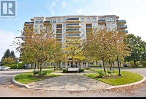 Brampton (Goreway Drive Corridor) condo for rent - A large apartment building with a courtyard in front.