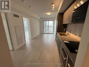 Toronto (Agincourt South-Malvern West) condo for rent - A modern kitchen with a large island and stainless steel appliances.